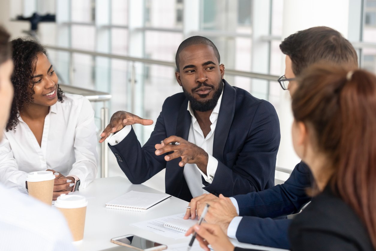 Black-millennial-boss-leading-corporate-team-during-briefing-in-boardroom-1139630453_1258x838 (1)